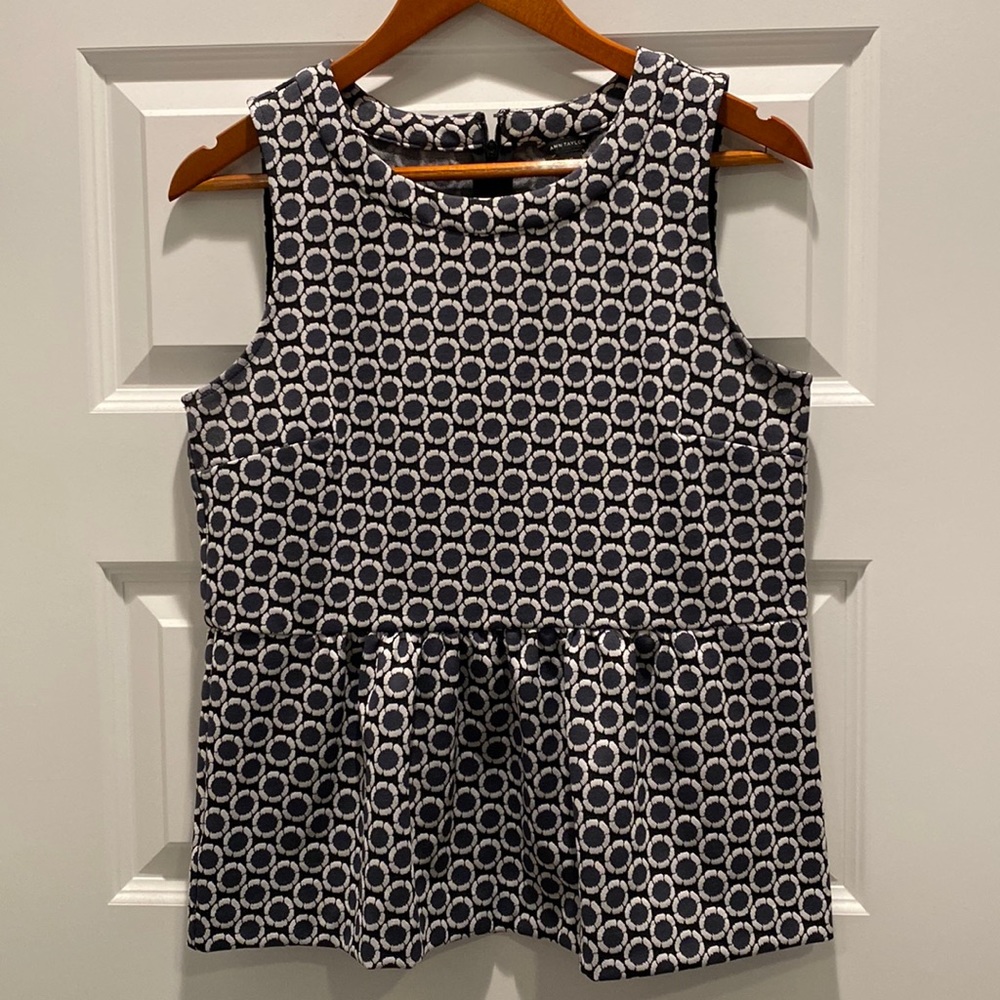 Medium peplum navy top with floral detail. Great quality